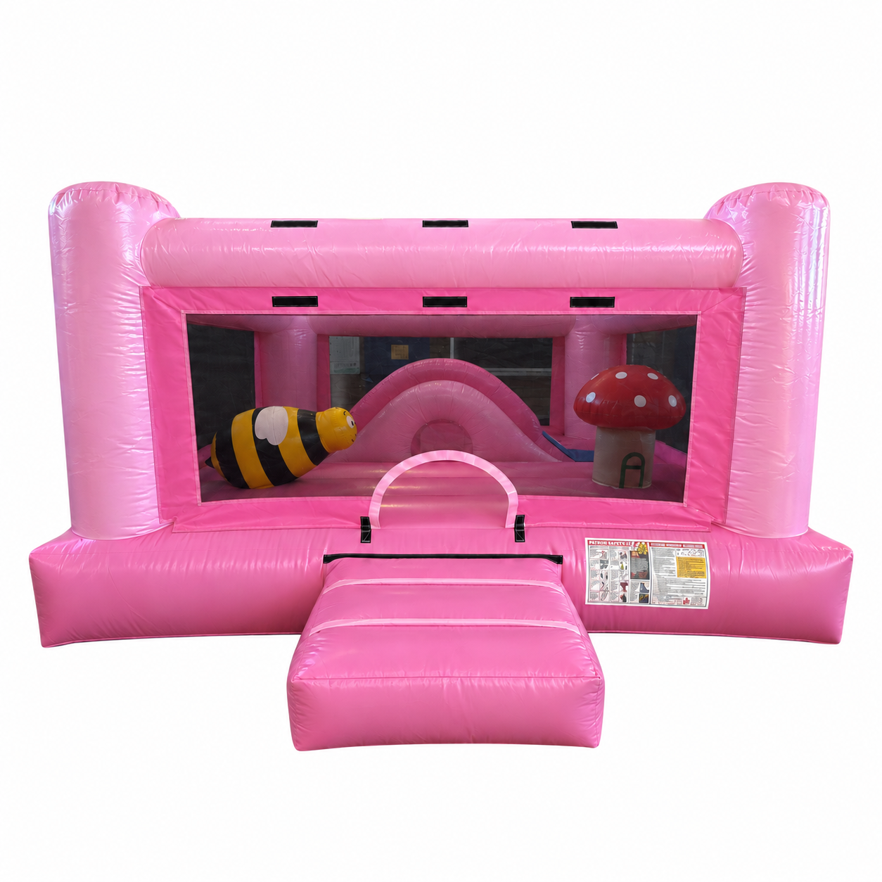 Pink indoor inflatable playland with a bee, mushroom, climbing and crawling obstacles, and soft play features for young children.